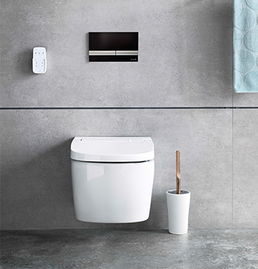 VitrA V-Care shower toilet with black and chrome flush plate
